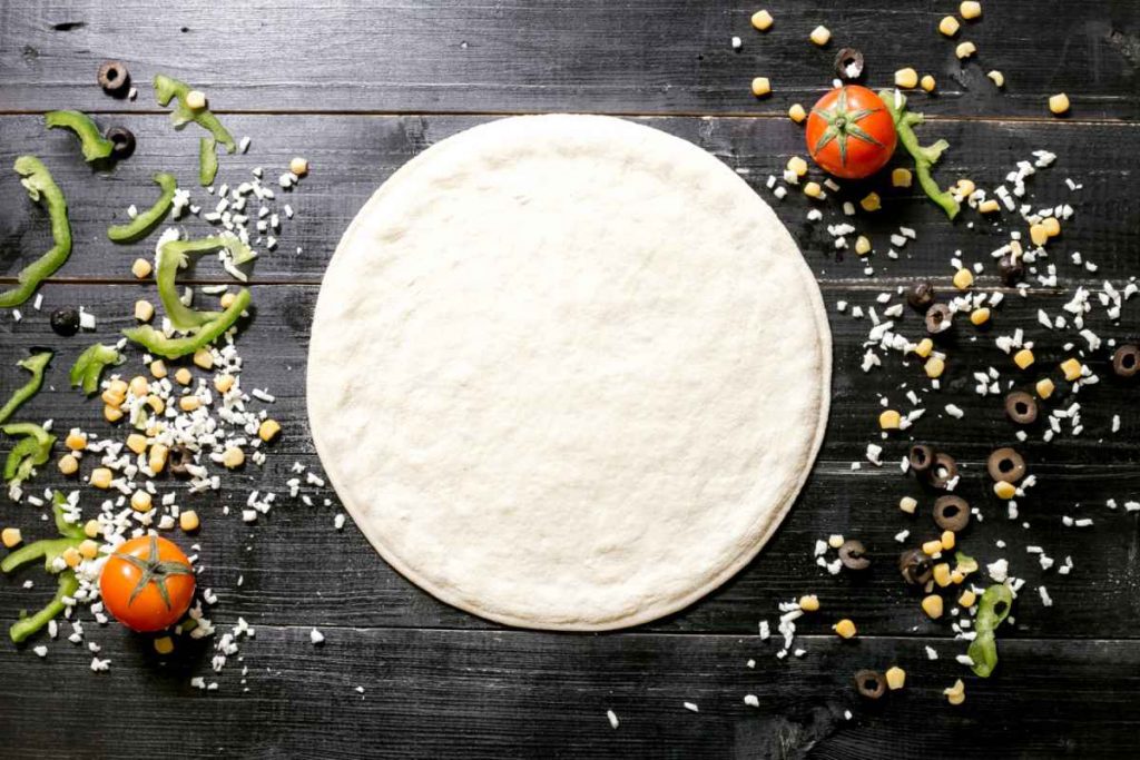 Perfectly Round  Pizza Dough with corn and tomatoes